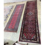 A North West Persian red ground runner and a Bokhara runner, larger approx. 290 x 78cm