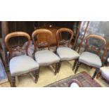 A set of four Victorian mahogany balloon back dining chairs (damage)