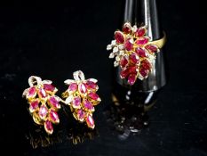 A modern 585 yellow metal, ruby and diamond cluster dress ring, size T and a pair of matching