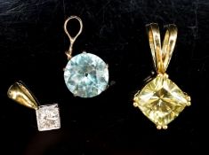 An 18ct and diamond set pendant, overall 14mm and two other gem set pendants, gross 6.5 grams,.