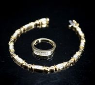 A modern 14k yellow metal and diamond chip set line bracelet, 18cm and a matching ring, size O/P,