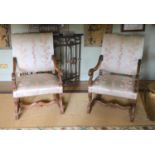 A pair of French carved walnut fauteuils, with machine embroidered Eau de Nil silk upholstery, width
