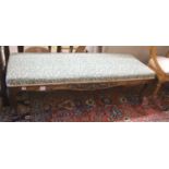 A late 19th century carved walnut upholstered window seat, length 136cm, depth 48cm, height 38cm