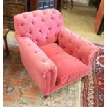 A George Smith armchair upholstered in buttoned pink fabric on turned legs, width 86cm, depth