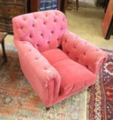 A George Smith armchair upholstered in buttoned pink fabric on turned legs, width 86cm, depth