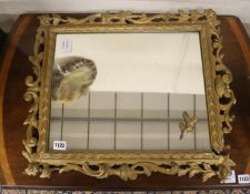 A Victorian style rectangular pierced gilt wood and gesso framed wall mirror, width 48cm, height