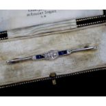 An Edwardian plat & 15ct, sapphire and diamond set bar brooch,61mm, gross 3.7 grams.