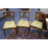 Attributed to Gillows of Lancaster. A set of six Regency rosewood dining chairswith scroll carved