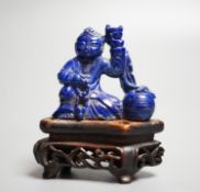 A Chinese carved lapis lazuli model of a Buddha, height 5.5cm (a.f.)