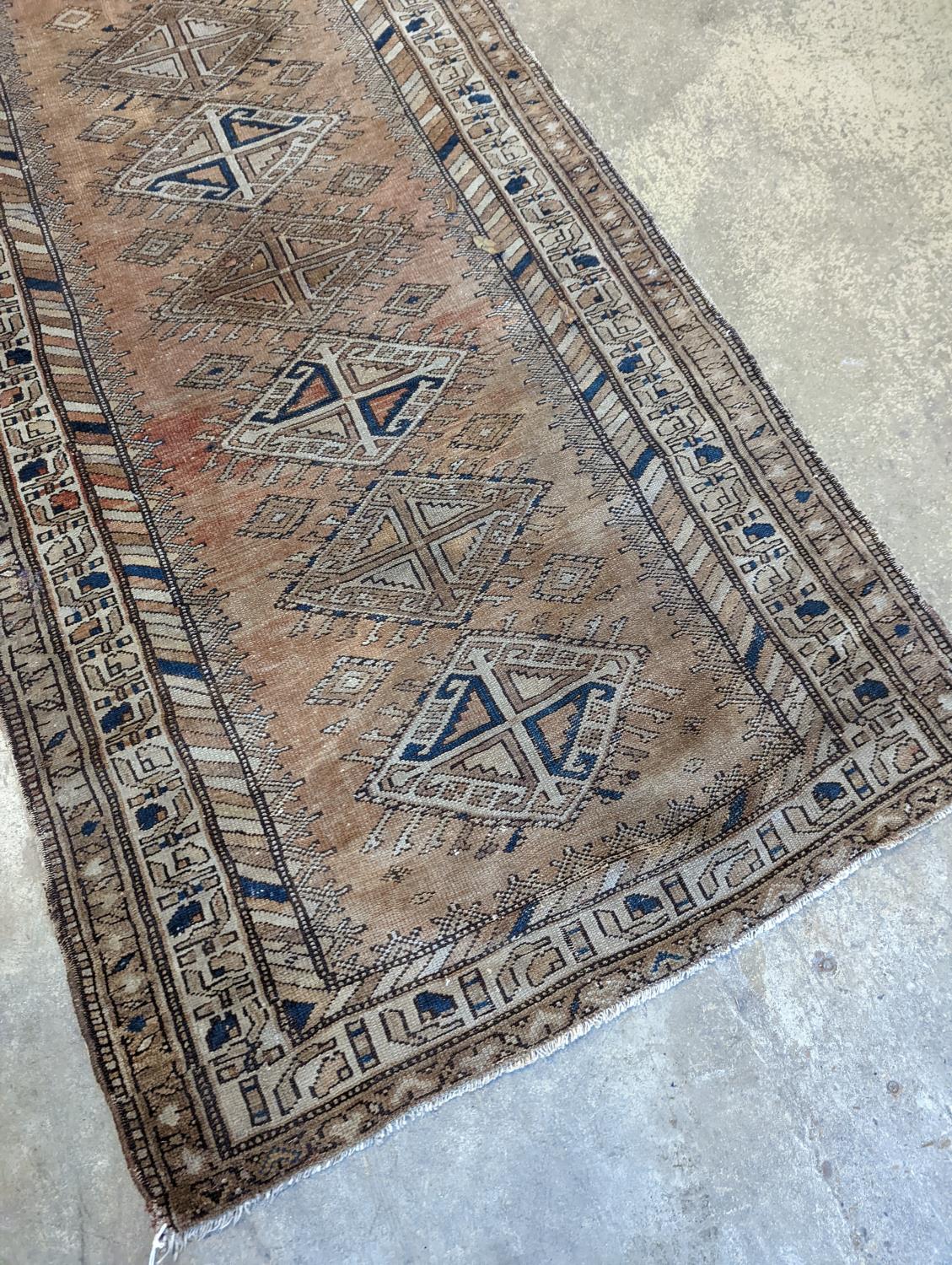 An antique Caucasian red ground runner, 372 x 106cm - Image 2 of 7