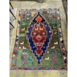 A Caucasian design blue ground rug, 180 x 128cm