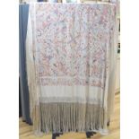A Chinese cream silk shawl with fine multi coloured all over embroidery depicting figurative