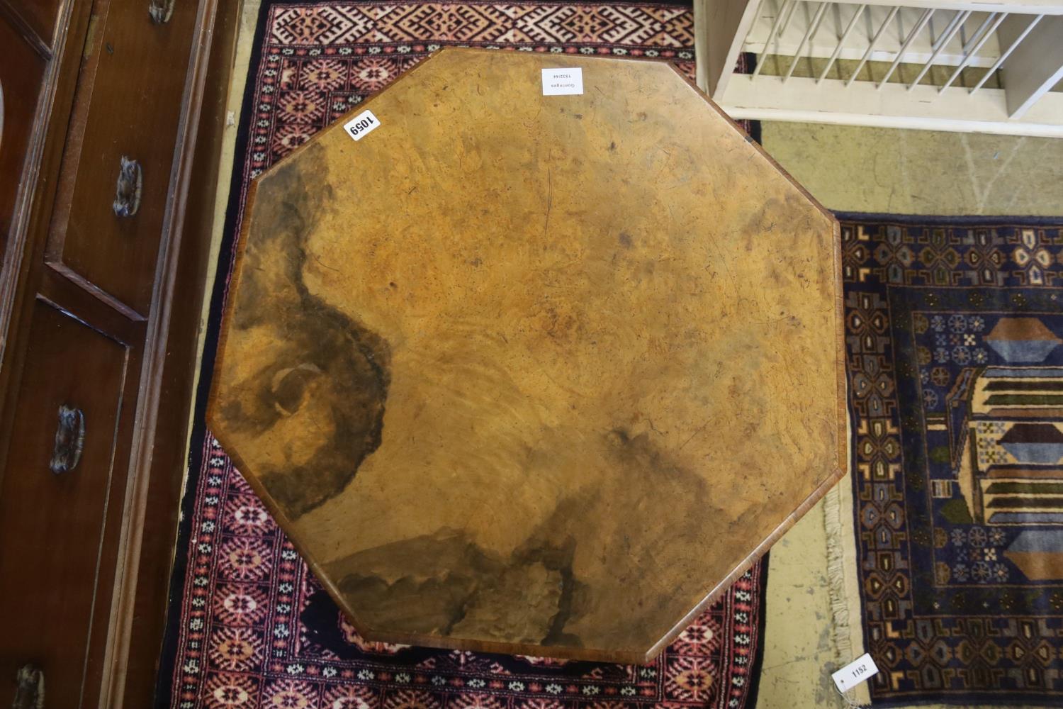 A Victorian burr walnut octagonal topped tea table, raised on leaf carved pillar and open scrolled - Image 2 of 3