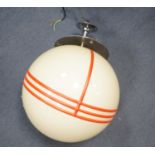 An Art Deco style chrome and cream globular shaded ceiling light with orange trailed decoration,