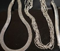 A 925 torque necklace, 46cm, a 925 multi strand necklace and a bracelet,necklaces gross 224 grams.