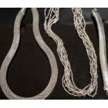 A 925 torque necklace, 46cm, a 925 multi strand necklace and a bracelet,necklaces gross 224 grams.