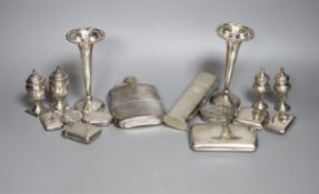 A group of assorted silver including two hip flasks, two spill vases, condiments, vesta cases,