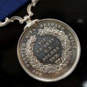A Royal Humane Society small silver medal, the clasp initialled R.T.M.