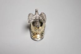 An early 20th century German parcel gilt 800 standard vodka tot modelled as a Prussian soldier's