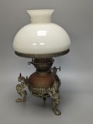 A brass and copper animal monopodia oil lamp, height 36cm