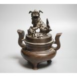 A Chinese copper alloy censer and cover with lion dog cover, height 20cm