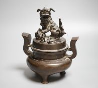 A Chinese copper alloy censer and cover with lion dog cover, height 20cm