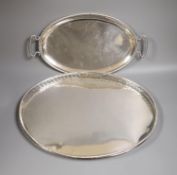 A late 19th century Hanau? embossed white metal oval dish, decorated with battle scene, 49cm, 24.