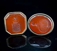 Two 19th century yellow metal overlaid and carnelian set fob seals, largest 43mm.