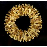 A 1970's textured 18ct gold modernist circular pendant, 35mm, 16 grams.