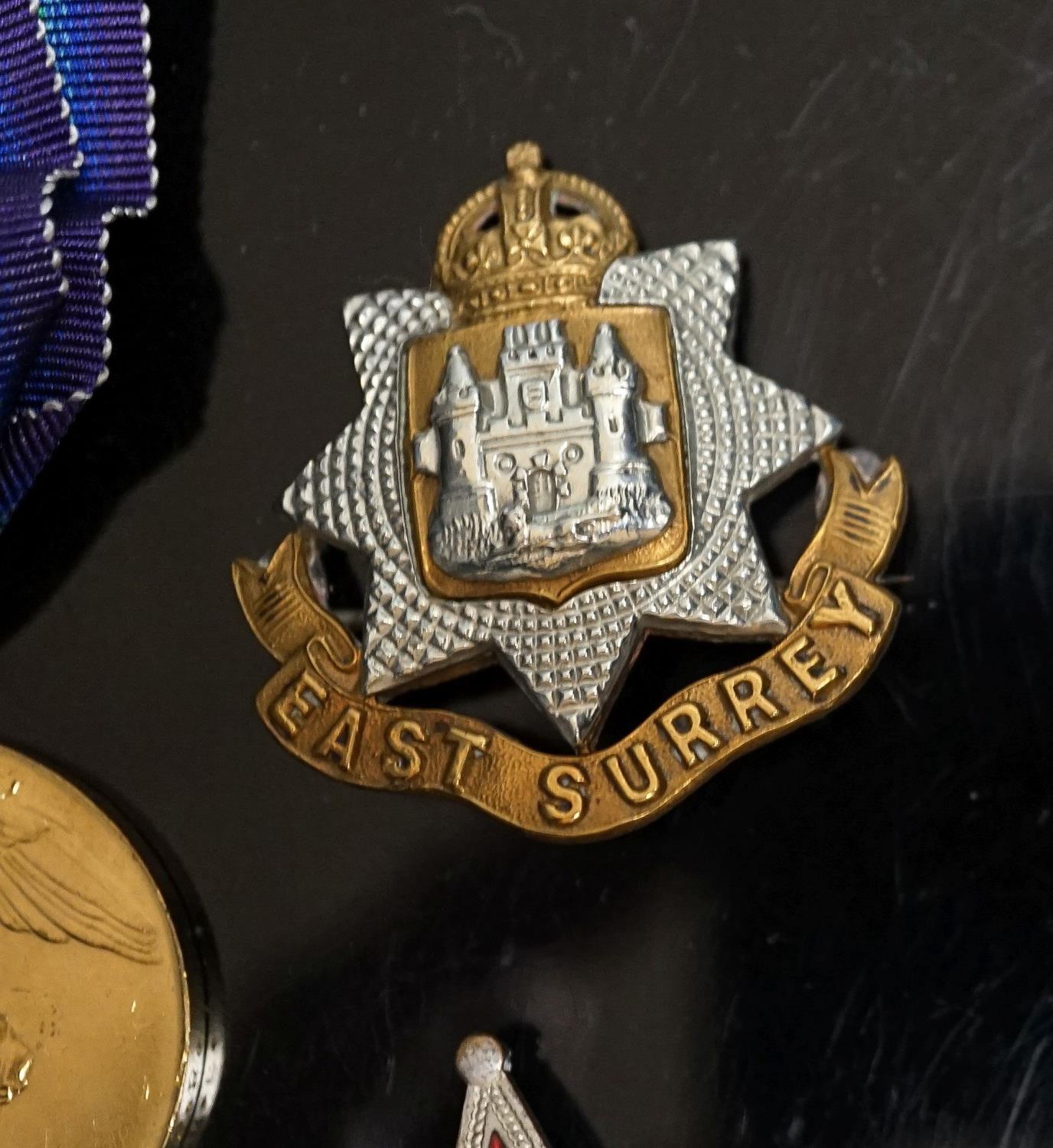 A WWI pair to 23125 PTE. H. ROFE E.SUR. R., together with an East Surrey Regiment cap badge, two - Image 3 of 4
