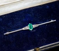 A boxed 1920's white metal (stamped pt), emerald and diamond chip set bar brooch, 51mm, gross weight