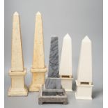 Two pairs of simulated stone obelisks, another pair and a single, tallest 33cm