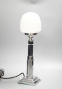An Art Deci chrome and glass lamp