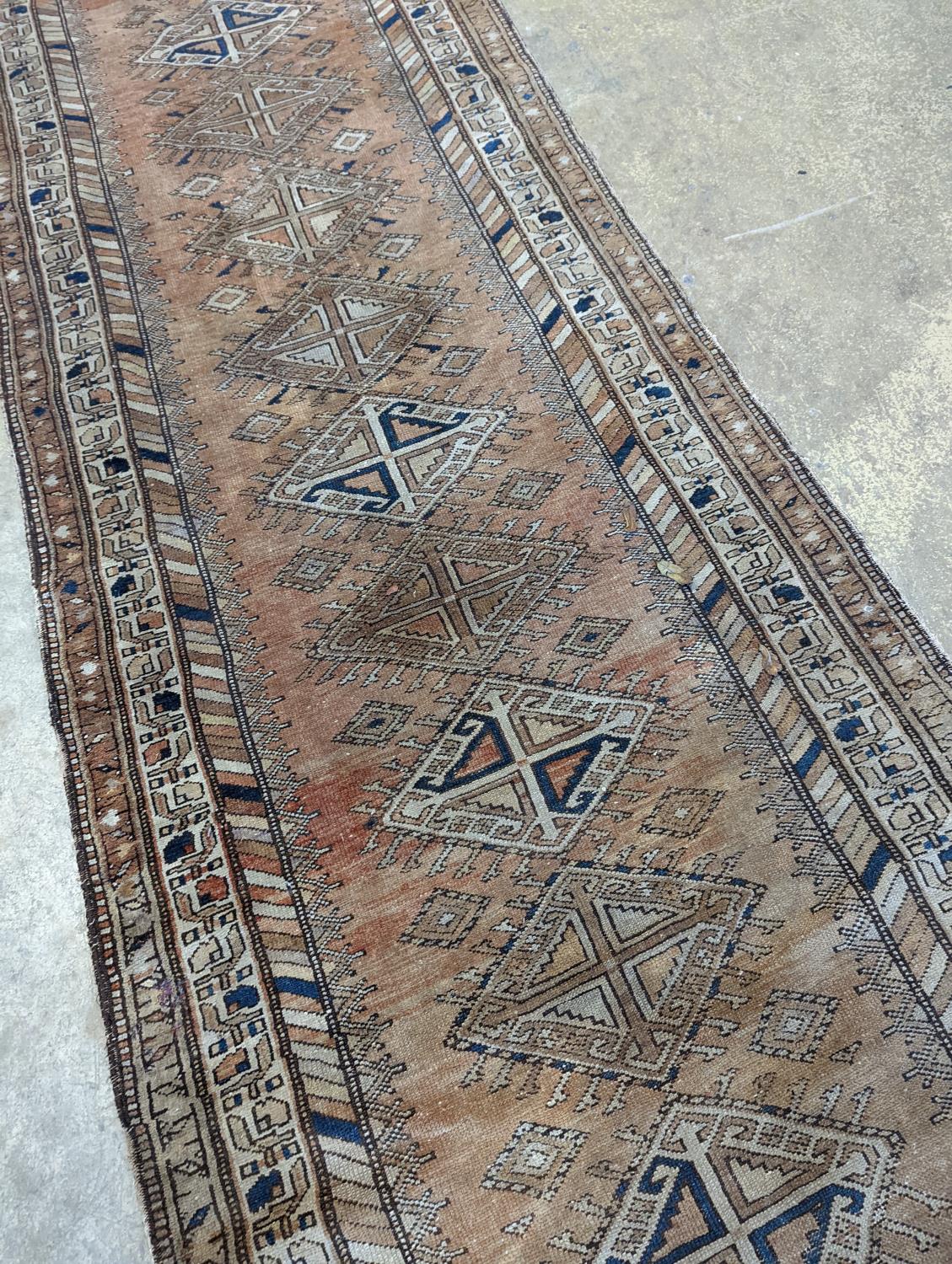 An antique Caucasian red ground runner, 372 x 106cm - Image 3 of 7
