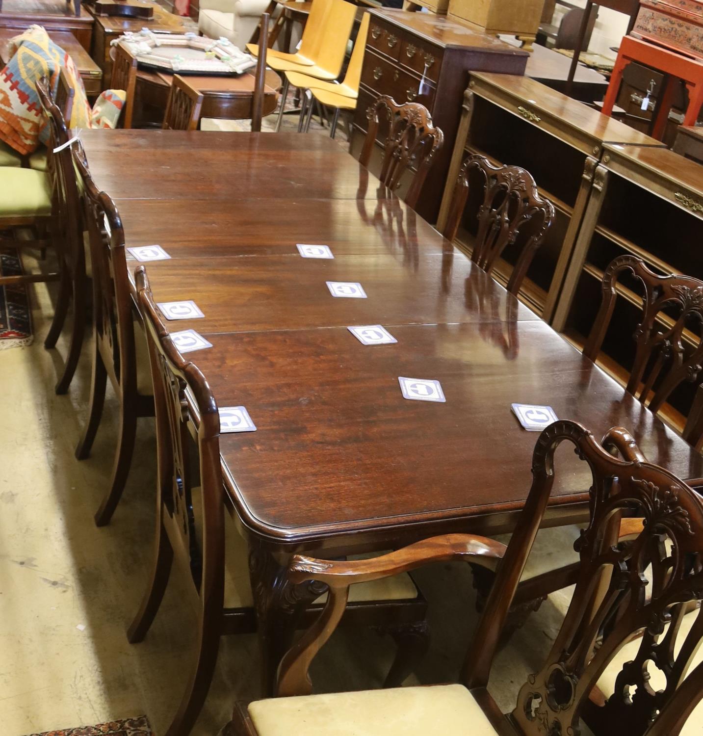 A set of eight George III style mahogany dining chairs with ball and claw feet together with a