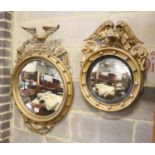 A small Regency gilt convex wall mirror, with eagle leaf carved surmount and ball surround and