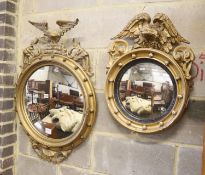 A small Regency gilt convex wall mirror, with eagle leaf carved surmount and ball surround and