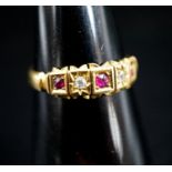 A late Victorian 18ct gold, ruby and diamond chip set half hoop ring, size O, gross 2.5 grams.