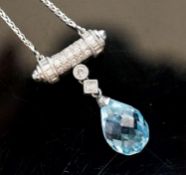 A modern 750 white metal, facet cut pear shaped aquamarine and diamond chip set drop pendant,