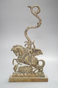 A brass door stop, St. George vanquishing the Dragon, height 40cm