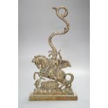 A brass door stop, St. George vanquishing the Dragon, height 40cm