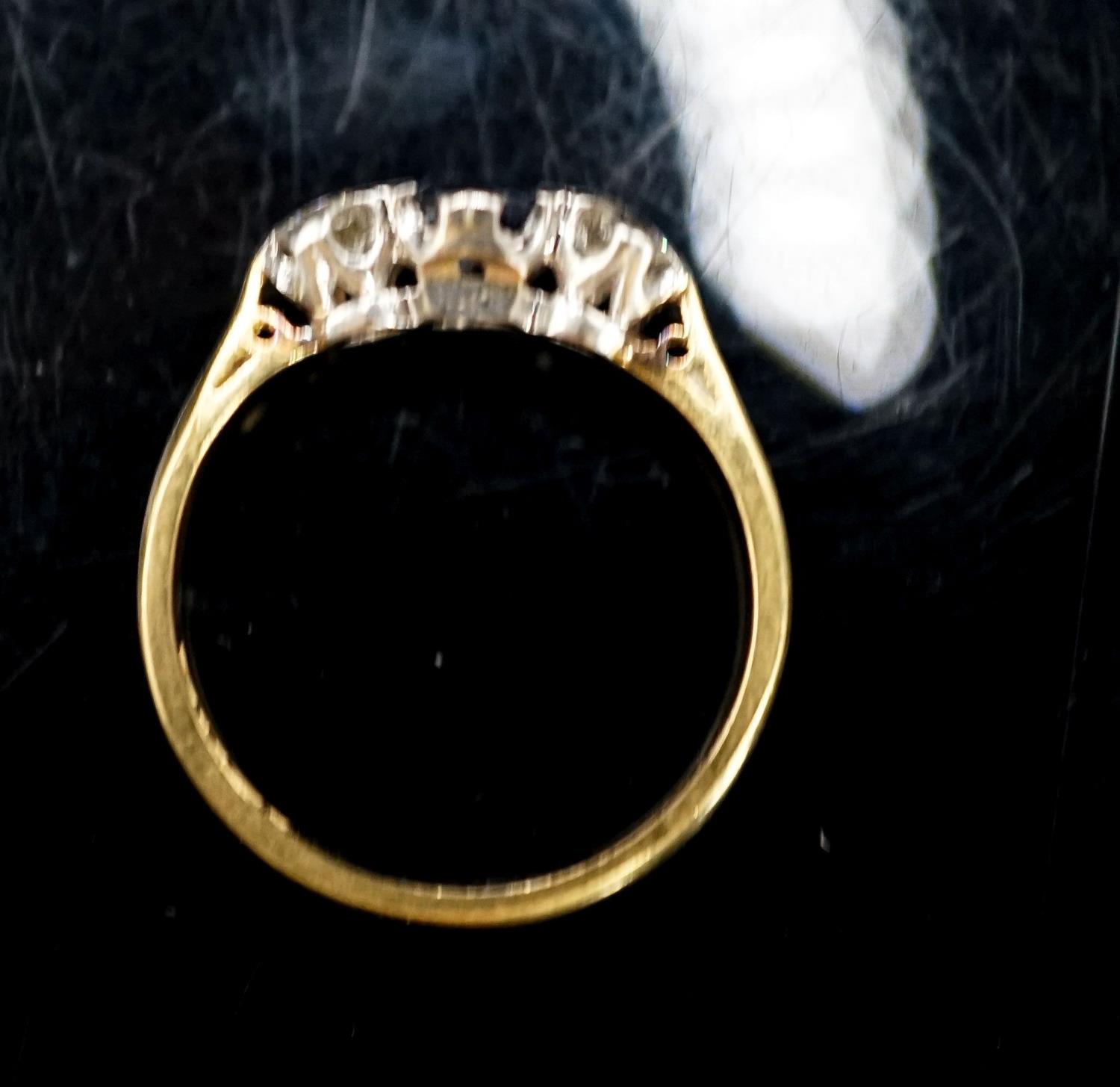 A modern 18ct gold, sapphire and diamond set three stone ring, size L/M, gross 3 grams. - Image 3 of 3