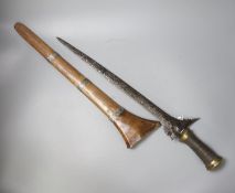 An Indonesian dagger kris, 19th century, earlier broad black and silver-coloured watered blade,