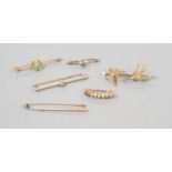 A collection of six assorted yellow metal bar brooches, including seed pearl set twin swallow,