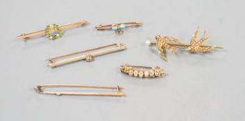 A collection of six assorted yellow metal bar brooches, including seed pearl set twin swallow,