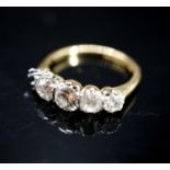 An 18ct, plat and graduated four (ex five) stone diamond set half hoop ring, size L/M, gross 2.9