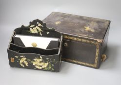 A chinoiserie lacquered caddy with internal liner and a lacquered letter rack (2)