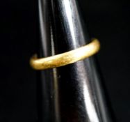 A 22ct gold wedding band, 4.6 grams.