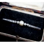 An early 20th century pearl and diamond set bar brooch, 50mm, gross 3.8 grams.
