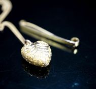 A 9ct tie pin and a yellow metal heart shaped pendant on a 9c fine link chain, gross weight 5.9